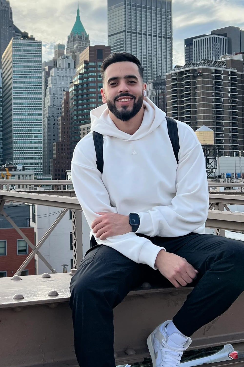 Me smiling in a white hoodie