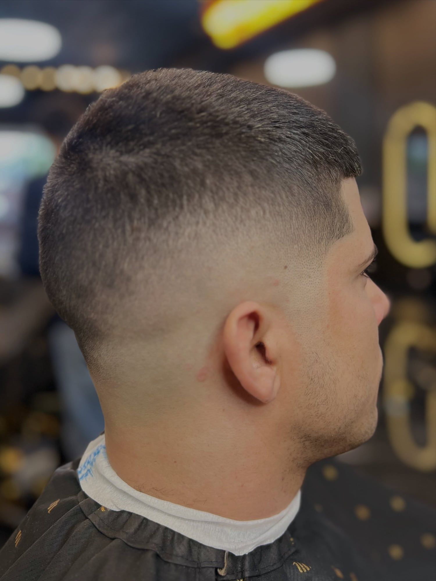 The side and back of a skin fade with no line in the blend